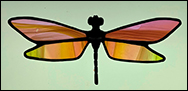 Stained Glass Dragonfly in shades of pink, orange, and green!