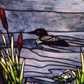 Scenic vista of loon on Thompson Lake in Stained Glass
